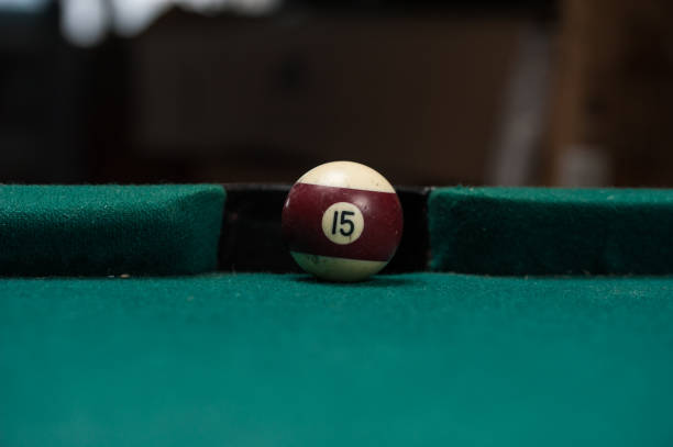 istock Billiards balls and cue on billiards table. Billiard sport concept. 1214358200