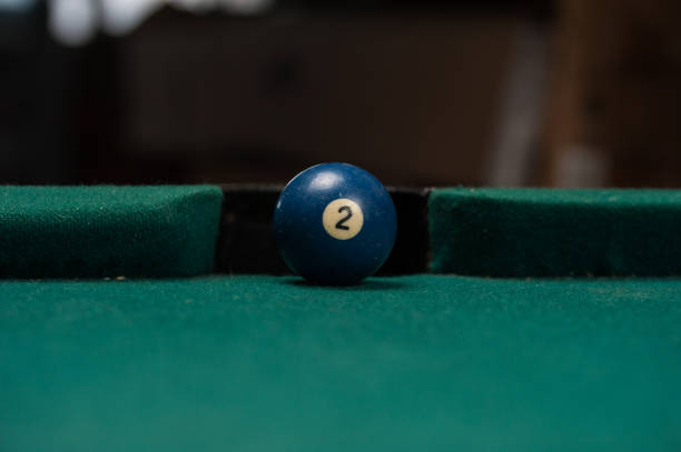 istock Billiards balls and cue on billiards table. Billiard sport concept. 1214358220