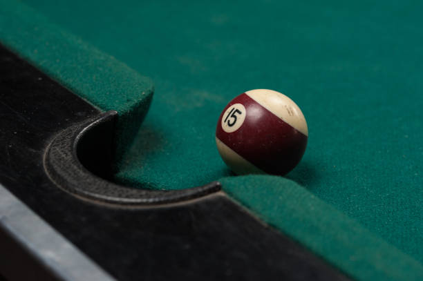 istock Billiards balls and cue on billiards table. Billiard sport concept. 1214358268