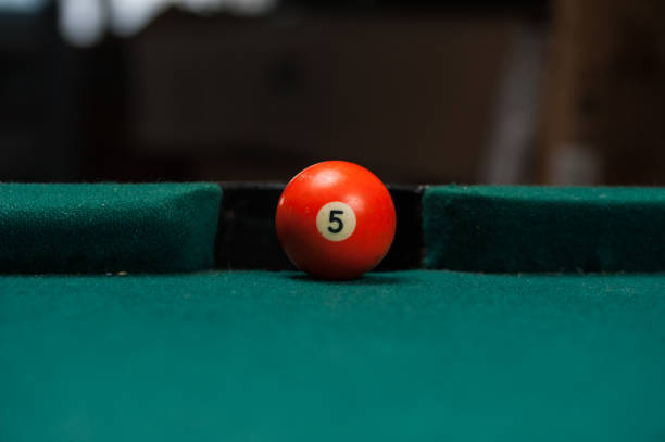 istock Billiards balls and cue on billiards table. Billiard sport concept. 1214358305