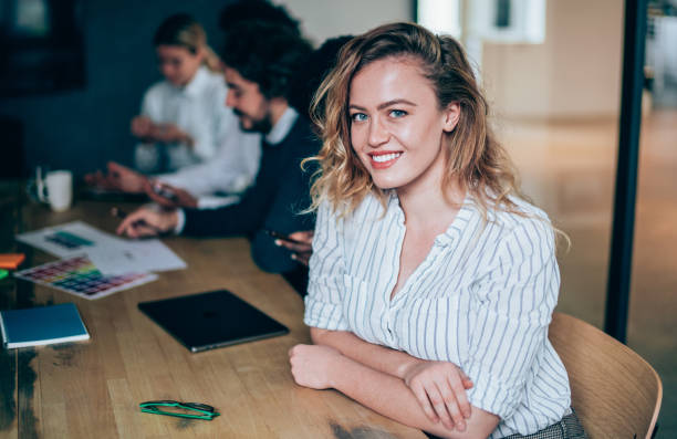 istock Confident businesswoman and her team. 1214358306
