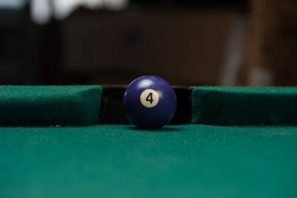 istock Billiards balls and cue on billiards table. Billiard sport concept. 1214358348