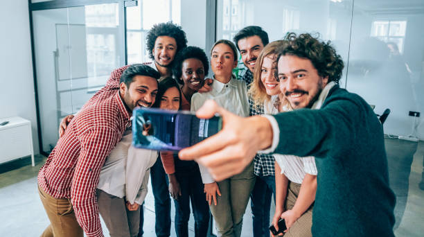 istock Selfie with colleagues in the office. 1214358352