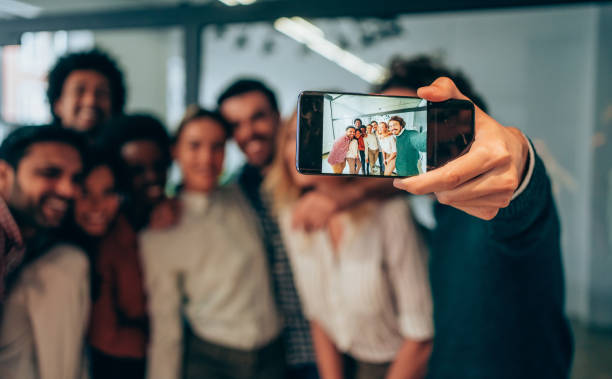 istock Selfie with colleagues in the office. 1214358361