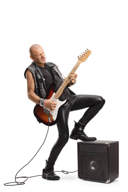 istock Man rock star playing a guitar with an amplifier 1214363846