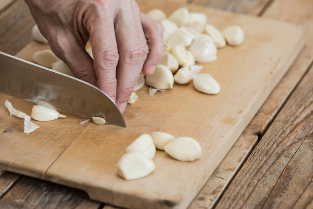istock Garlic chopped at chopping board, close-up 1214365184