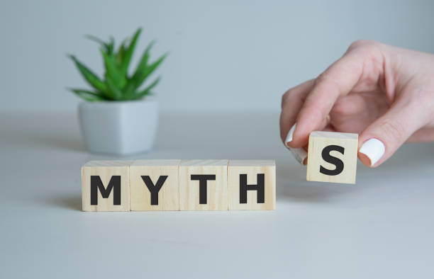 istock hand hold Wooden Blocks with the text: Myths. 1214366026