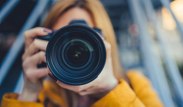 Photographer is taking pictures with camera