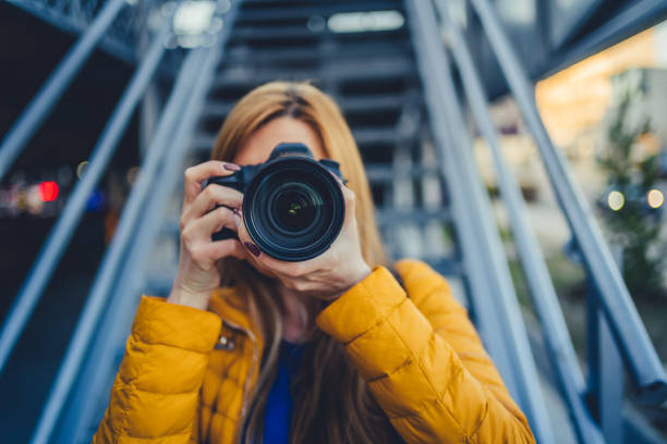 istock Photographer is taking pictures with camera 1214369438