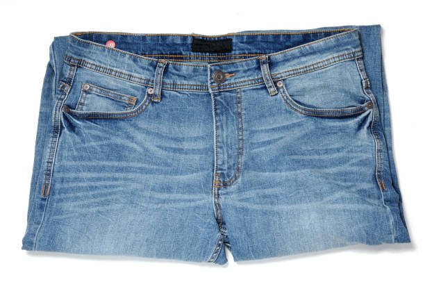 istock Denim pants in blue on a white background 1214372457