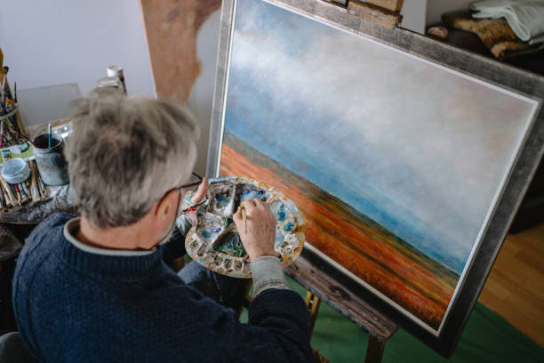 istock Serene senior painting during his retirement 1214373290