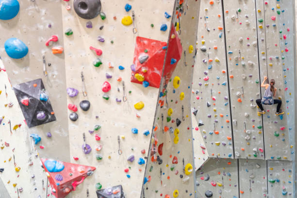 istock Young Woman Indoor Rock Climbing 1214374878
