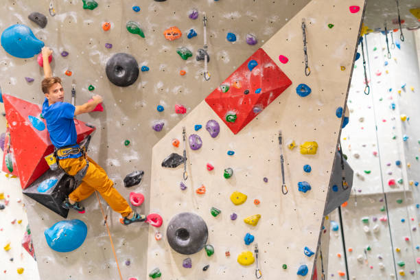 istock Young Man Indoor Rock Climbing 1214374891