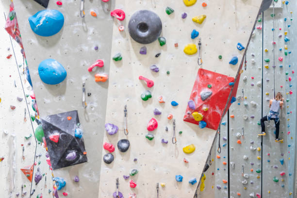 istock Young Woman Indoor Rock Climbing 1214374895