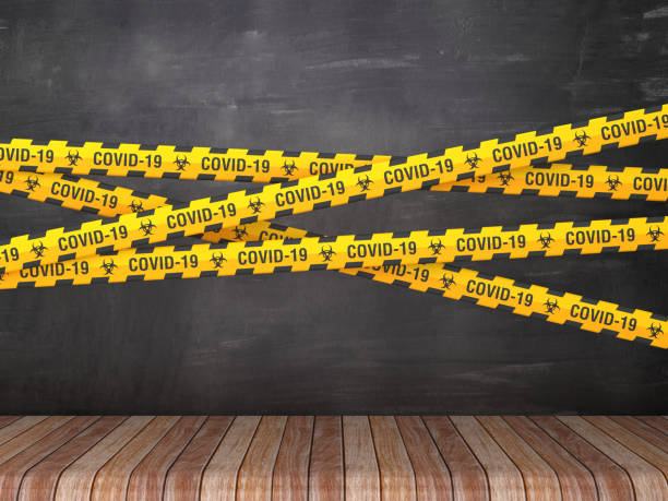 istock Cordon Tape with COVID-19 Word on Chalkboard Background - 3D Rendering 1214375167