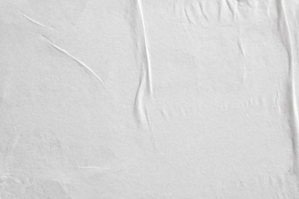 istock Blank white crumpled and creased paper poster texture background 1214375189