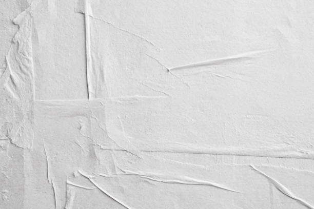 istock Blank white crumpled and creased paper poster texture background 1214375191