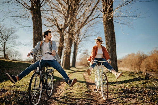 istock Couple relaxing on the sun with bicycle in nature 1214377487