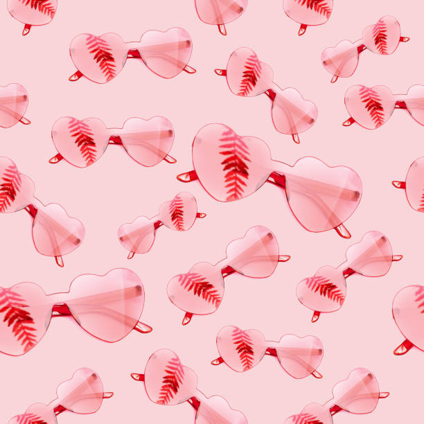 istock Seamless pattern from stylish heart shaped glasses with shadow from palm leaves on pink background. Fashion summer banner. 1214383223