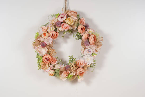 istock spring floral wreath with door decor on white background 1214384170