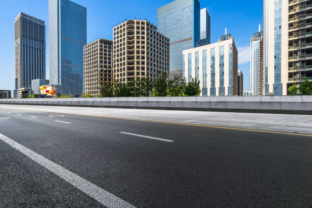istock city empty traffic road with cityscape in background 1214386104