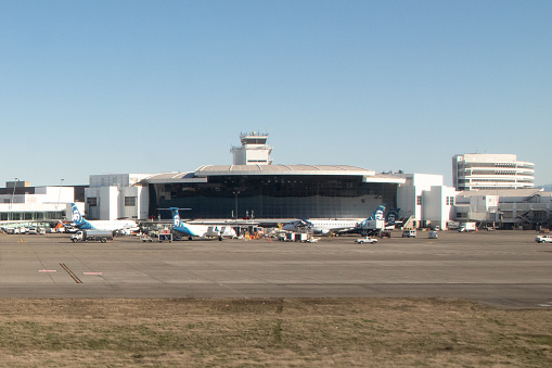 Seattle, Washington/ USA - March 13 2019: Alaska Airlines Aircraft sit on the Concourse C Airfield Apron in front of Seattle-Tacoma International Airport's Central Terminal
