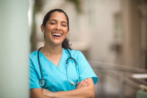 istock Confident hospital nurse smiling at work. 1214390515