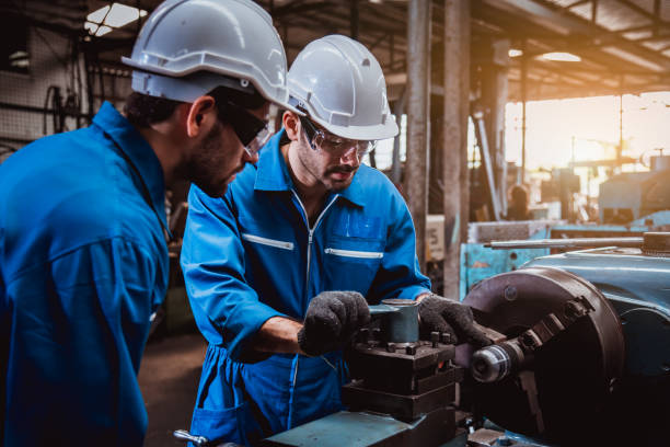 istock The Industry engineering wearing safety uniform used Vernier caliper to measure the object control working in industry factory. 1214390590