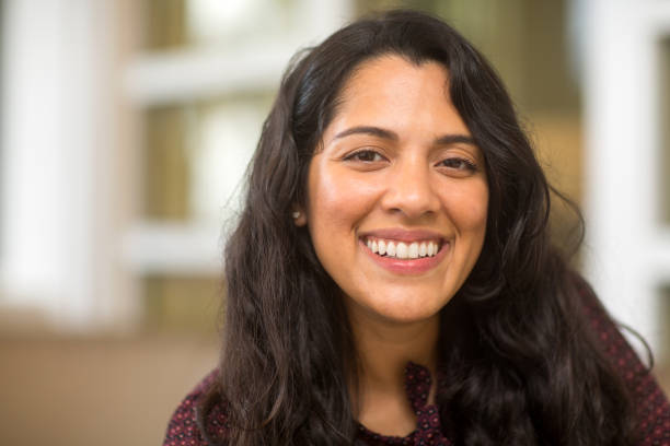 istock Young Hispanic woman smiling. 1214390634