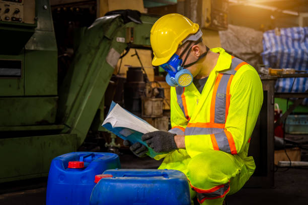 a engineer industry wearing safety uniform ,black gloves and gas mask under checking chemical tank in industry factory work. - half tank imagens e fotografias de stock