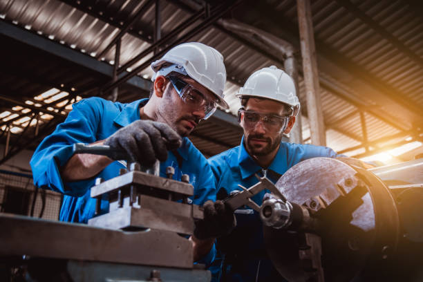 istock The Industry engineering wearing safety uniform used Vernier caliper to measure the object control working in industry factory. 1214391427
