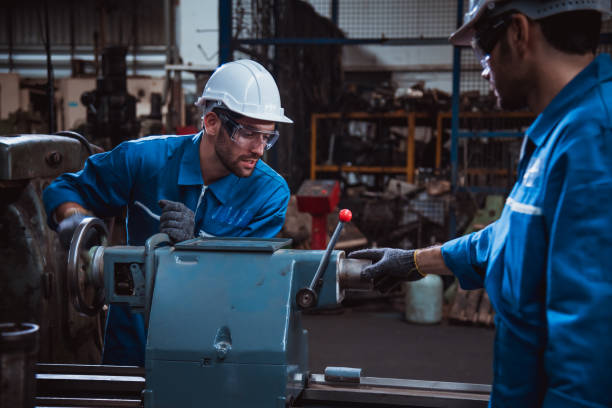 istock The Industry engineering wearing safety uniform used Vernier caliper to measure the object control working in industry factory. 1214391430