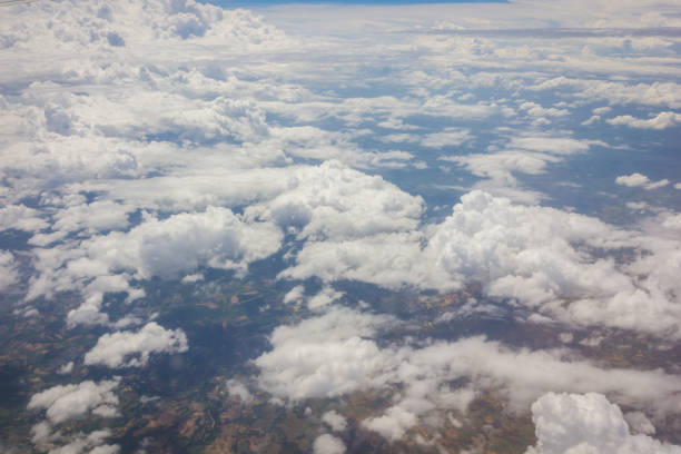istock Blue sky with clouds background on the airplane 1214392295
