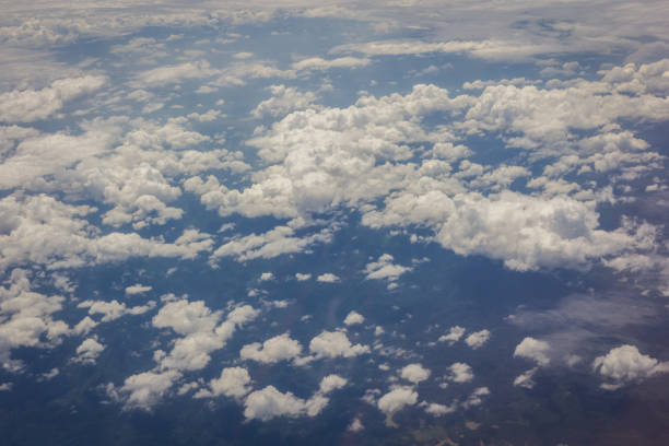 istock Blue sky with clouds background on the airplane 1214392298