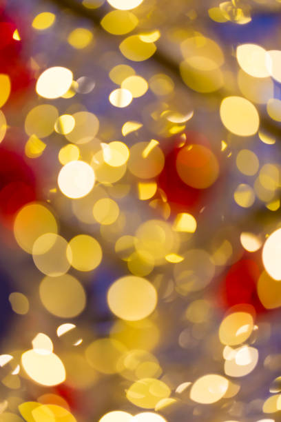 istock Defocused abstract christmas golden bokeh with red color 1214392958