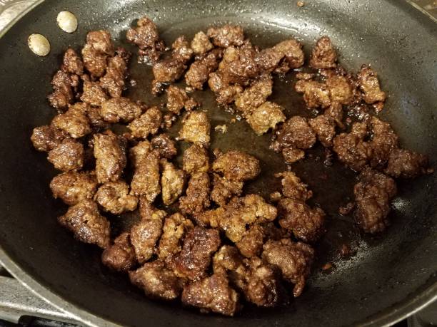istock ground beef cooking in frying pan with oil 1214393100