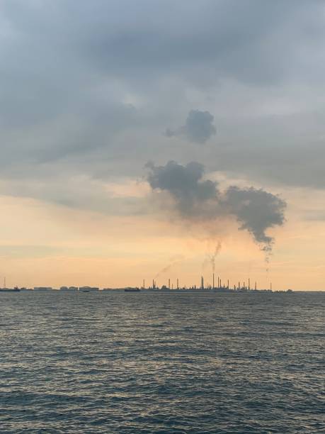 istock Pollution from petrochemical plants at dusk 1214394718