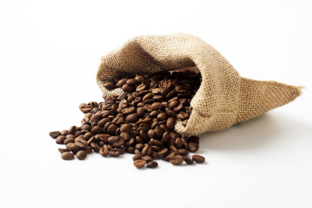 istock Jute bag with coffee beans on white 1214394772