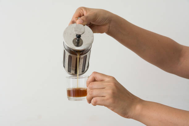 istock Hand holding a French Press coffee on white background 1214396913