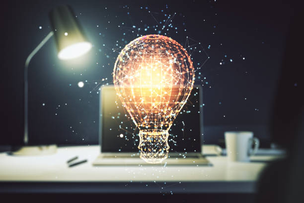istock Creative light bulb hologram on modern laptop background, idea concept. Multiexposure 1214397846