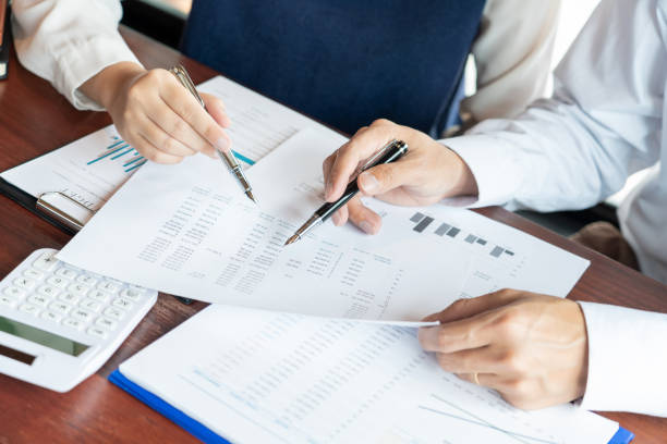 istock working together in office concept, young businessmen using touchpad digital tablet to discuss the situation on the market or stock yield graph chart at meeting office 1214400131
