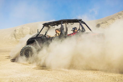 Active Group of Men and Boys Outdoor Fun ATV Rides and Shooting Activities in Western Colorado Desert Off-road Fun (Shot with Canon 5DS 50.6mp photos professionally retouched - Lightroom / Photoshop - original size 5792 x 8688 downsampled as needed for clarity and select focus used for dramatic effect)