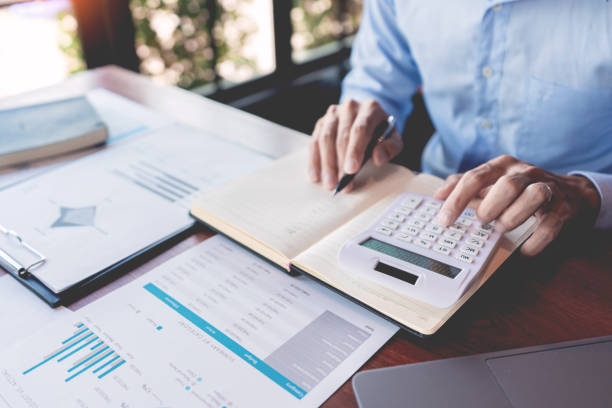 istock strategy analysis concept, Businessman working  financial Manager Researching Process accounting calculate analyse market graph data stock information review on the table in office. 1214400753