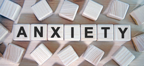 istock ANXIETY- text wooden cubes and many cubes around 1214400873