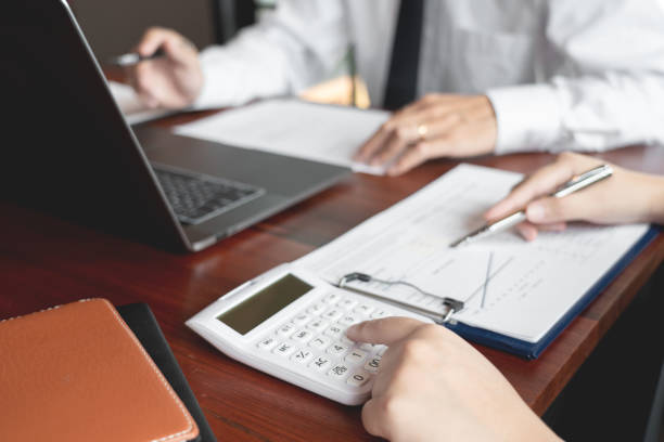 istock working together in office concept, young businessmen using touchpad digital tablet to discuss the situation on the market or stock yield graph chart at meeting office 1214400884