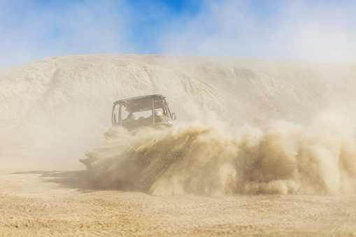 UTV buggy and 4x4 off road vehicle in a sandy track. Buggy extreme riding