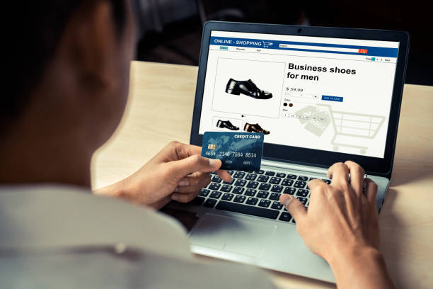 istock Young man use credit card for online shopping 1214405536