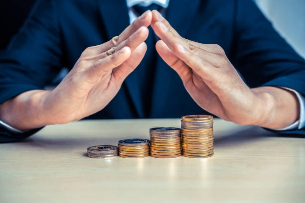 istock Businessman working with coin money currency. 1214405575