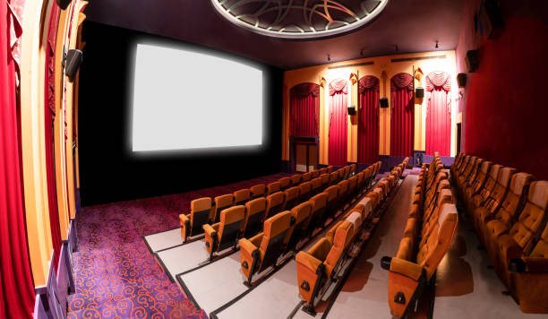 istock Cinema theater showing empty white movie screen. 1214405880