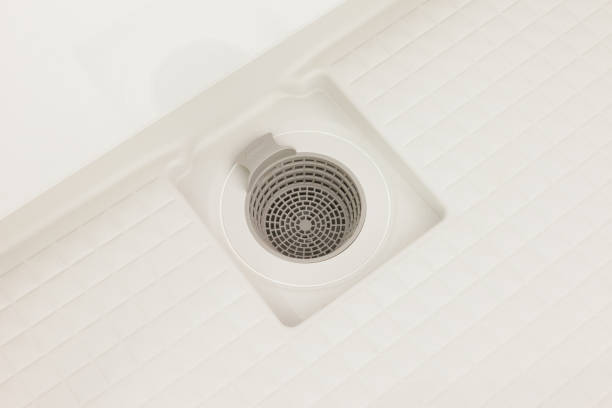 Drainage hole in the bathroom stock photo